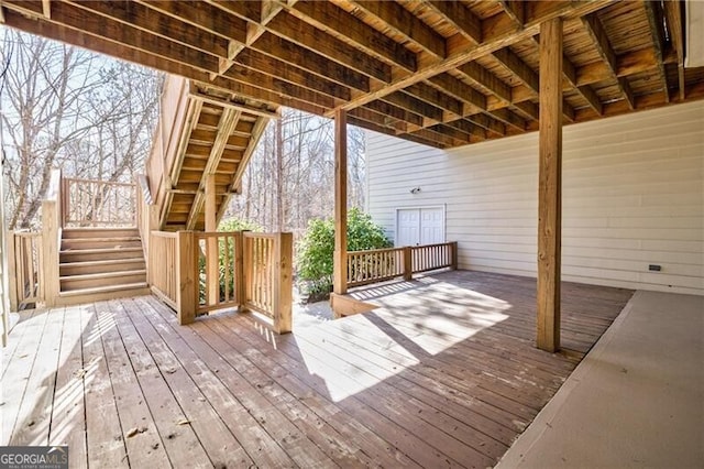 wooden deck featuring stairs