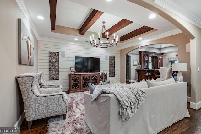 living room featuring arched walkways, dark wood-style flooring, baseboards, beamed ceiling, and an inviting chandelier