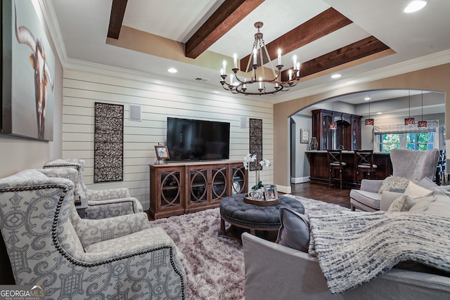 living area with arched walkways, a raised ceiling, beamed ceiling, an inviting chandelier, and crown molding