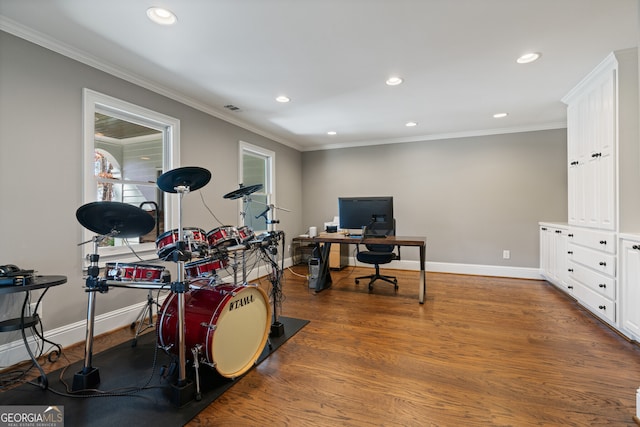 office space featuring baseboards, recessed lighting, wood finished floors, and crown molding