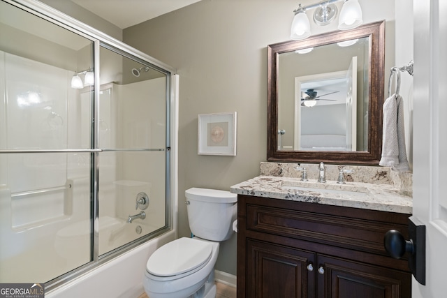 full bathroom with toilet, bath / shower combo with glass door, and vanity