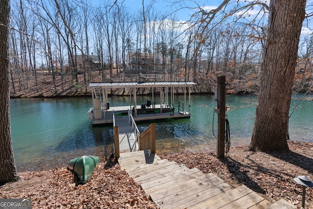 view of dock featuring a water view and boat lift