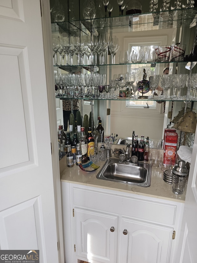 bar featuring a sink and indoor wet bar