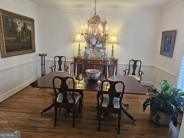 dining room with a chandelier, dark wood-style flooring, and crown molding