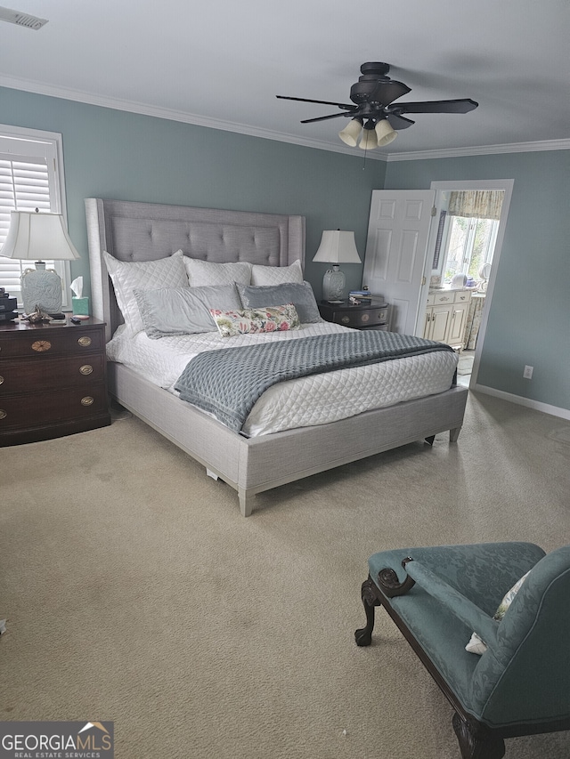 bedroom with connected bathroom, a ceiling fan, baseboards, visible vents, and crown molding