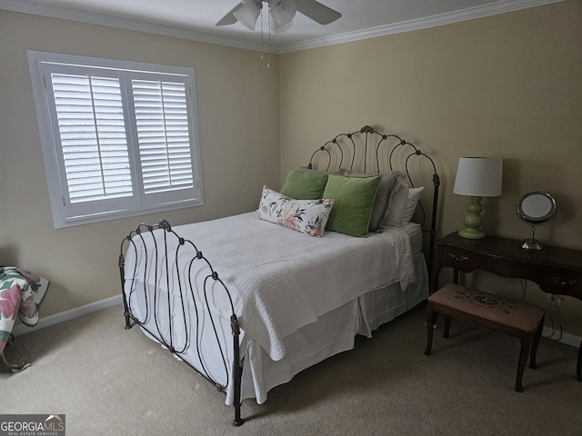 bedroom with ornamental molding, carpet, baseboards, and a ceiling fan