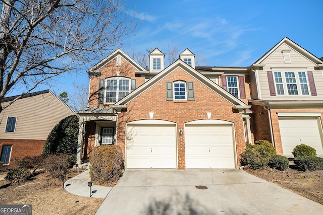 view of front of home featuring concrete driveway and brick siding