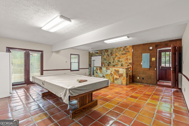 game room with electric panel, billiards, a textured ceiling, and tile patterned floors