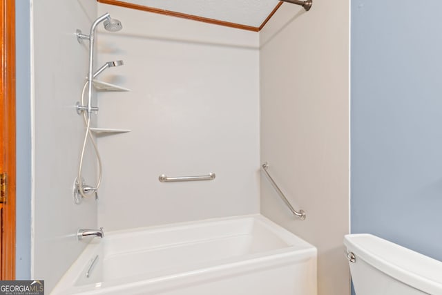 bathroom featuring toilet, ornamental molding, and shower / washtub combination