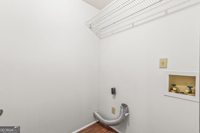 washroom with laundry area, washer hookup, wood finished floors, and electric dryer hookup