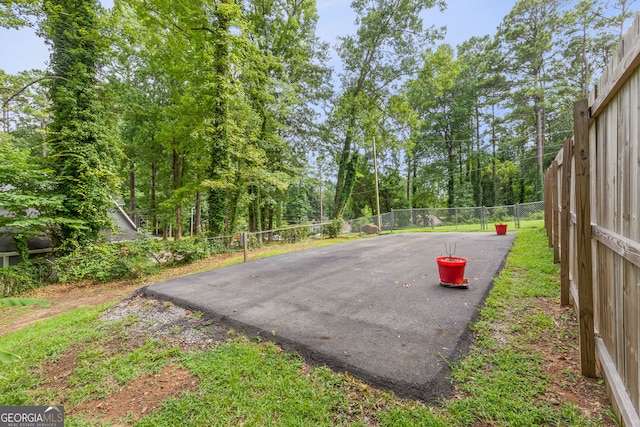 exterior space featuring fence and driveway