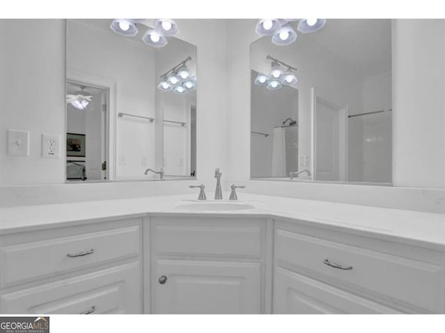 full bath featuring a shower with curtain and vanity