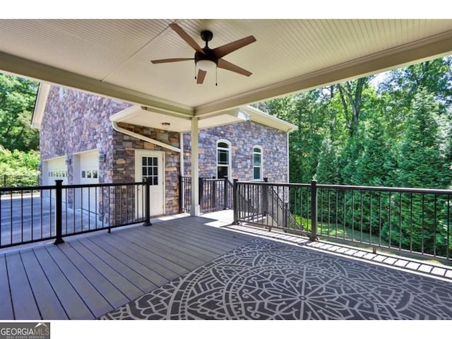 wooden deck with ceiling fan