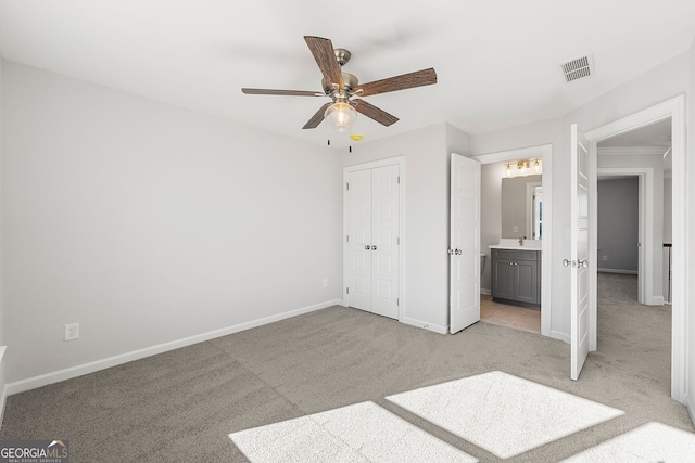 1295 Stonewood Field Rd, Watkinsville, GA 30677 - unfurnished bedroom featuring light colored carpet, ensuite bath, a closet, and ceiling fan