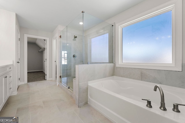 1295 Stonewood Field Rd, Watkinsville, GA 30677 - full bathroom with a bath, a stall shower, vanity, a spacious closet, and tile patterned floors