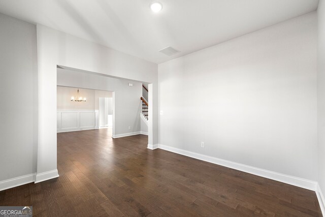 1295 Stonewood Field Rd, Watkinsville, GA 30677 - unfurnished room featuring a chandelier, stairs, and dark wood-type flooring