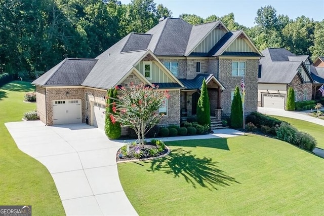 craftsman-style house featuring a garage, a front yard, board and batten siding, and concrete driveway