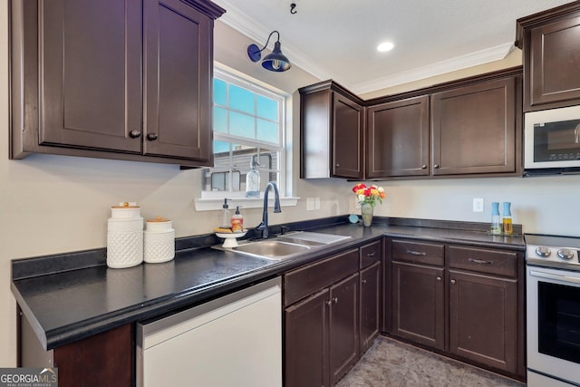 kitchen featuring dark countertops, dark brown cabinets, stainless steel appliances, and a sink