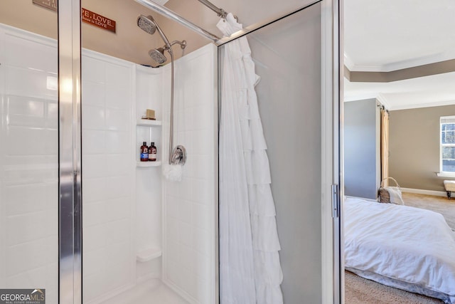 ensuite bathroom with ensuite bath, baseboards, crown molding, and a shower stall