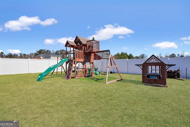 view of play area featuring a fenced backyard and a lawn