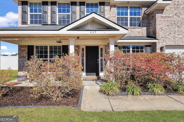 entrance to property with brick siding