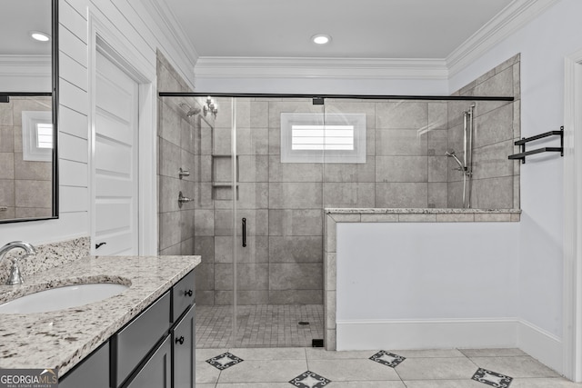 bathroom with ornamental molding, a shower stall, vanity, and tile patterned floors