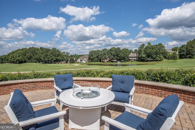 view of patio featuring a fire pit and golf course view