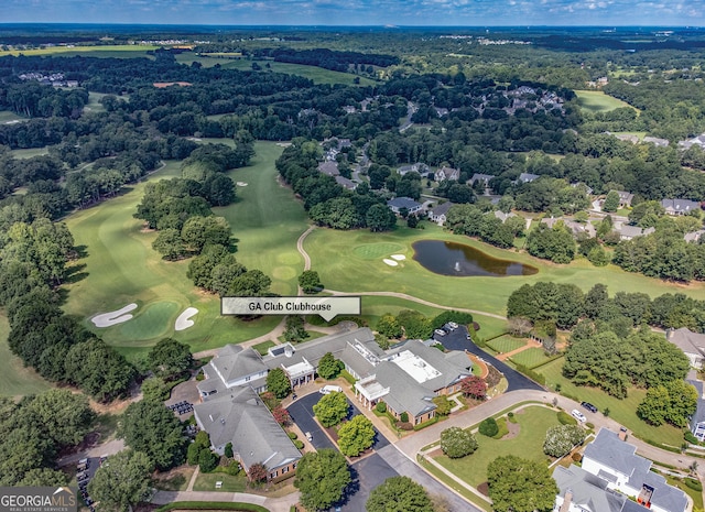 aerial view with a residential view, a water view, and golf course view