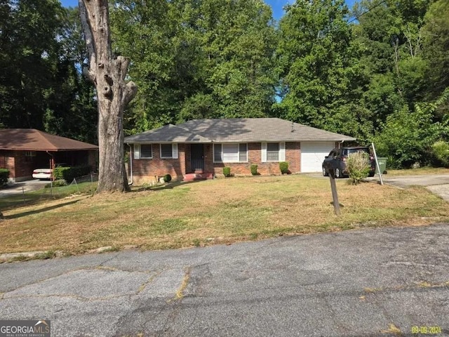 ranch-style home with a garage, brick siding, driveway, and a front lawn