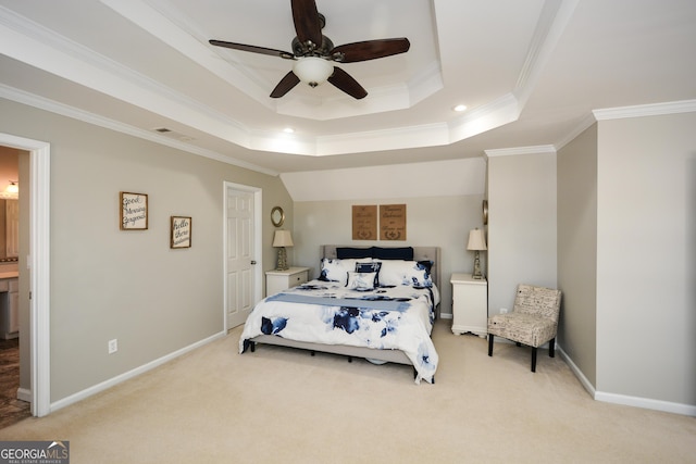 bedroom with a tray ceiling, crown molding, a ceiling fan, light carpet, and baseboards