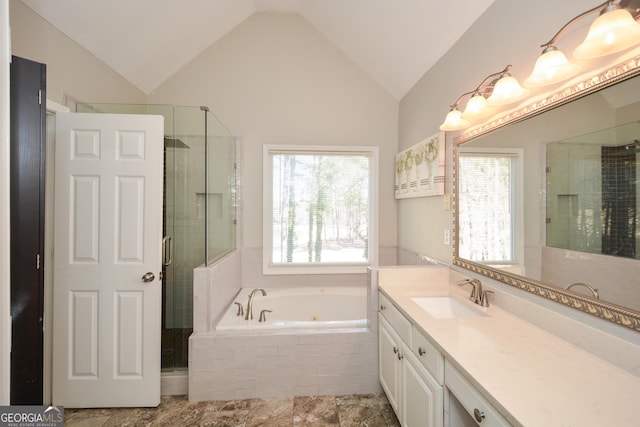 full bathroom with a stall shower, lofted ceiling, vanity, and a tub with jets