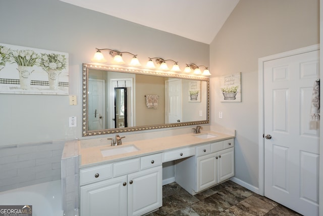 full bathroom featuring lofted ceiling, a sink, and double vanity