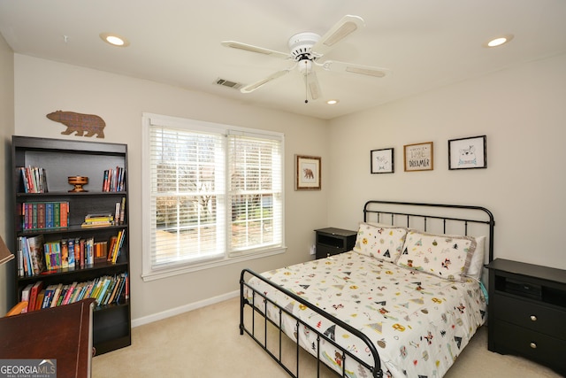 bedroom with recessed lighting, visible vents, light carpet, and baseboards