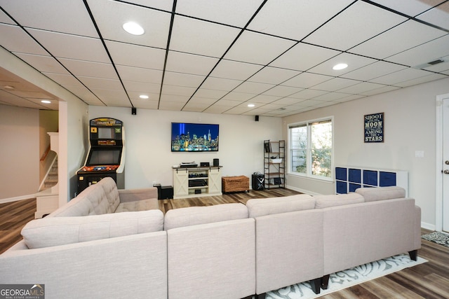 living area with recessed lighting, stairway, baseboards, and wood finished floors