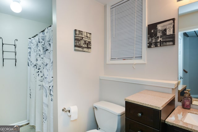 full bathroom with vanity and toilet