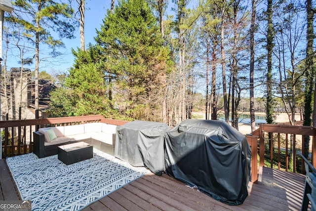 wooden deck featuring outdoor lounge area and grilling area