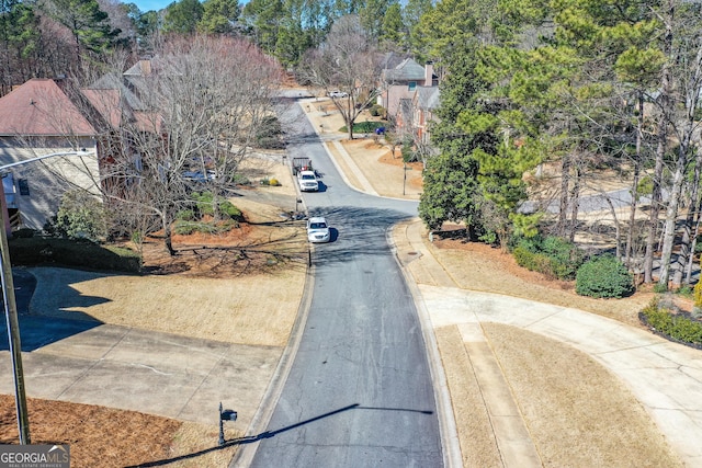 view of road featuring curbs and sidewalks