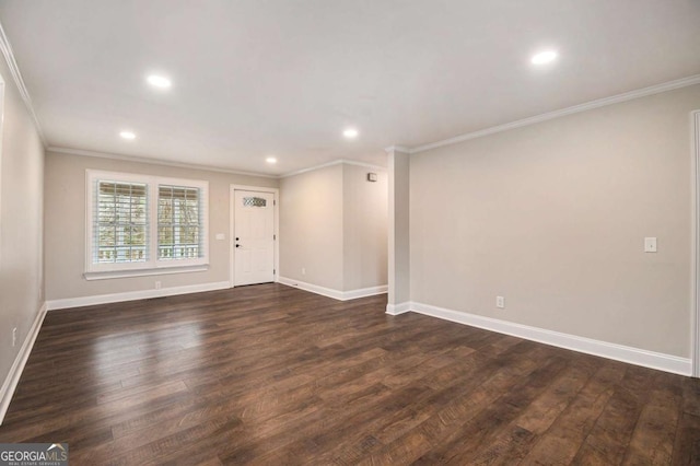 empty room featuring dark wood-type flooring, recessed lighting, and baseboards