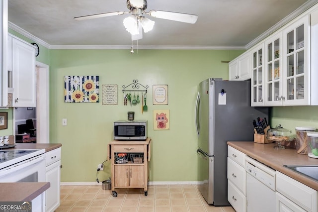 kitchen with white cabinets, ceiling fan, glass insert cabinets, appliances with stainless steel finishes, and ornamental molding