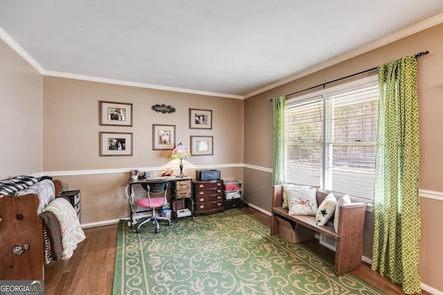 office space featuring baseboards, ornamental molding, and wood finished floors