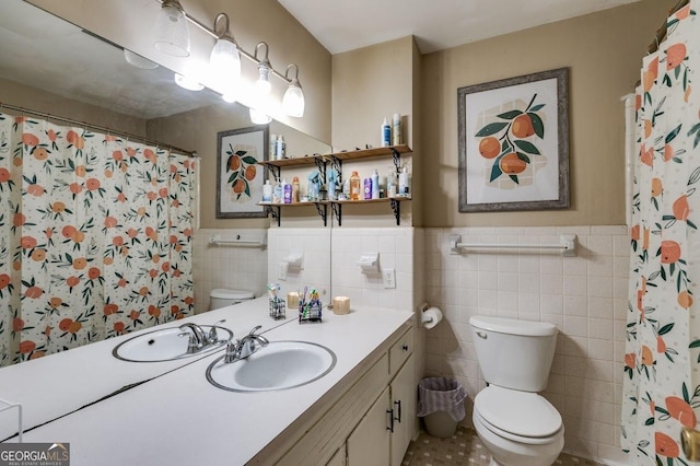 bathroom with a wainscoted wall, tile walls, a shower with shower curtain, toilet, and vanity