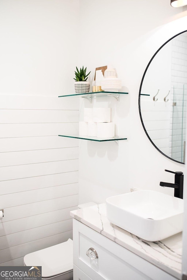 bathroom with vanity and toilet