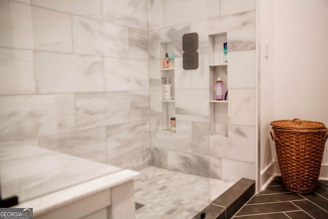 full bathroom with tiled shower