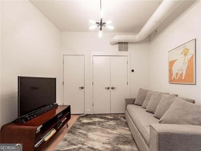 living room featuring visible vents