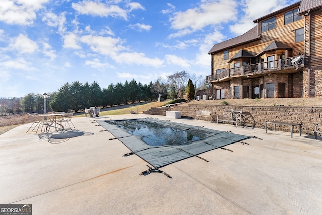 pool with a patio