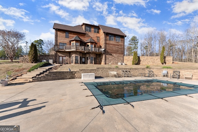 view of swimming pool with a patio area, stairs, and a fenced in pool