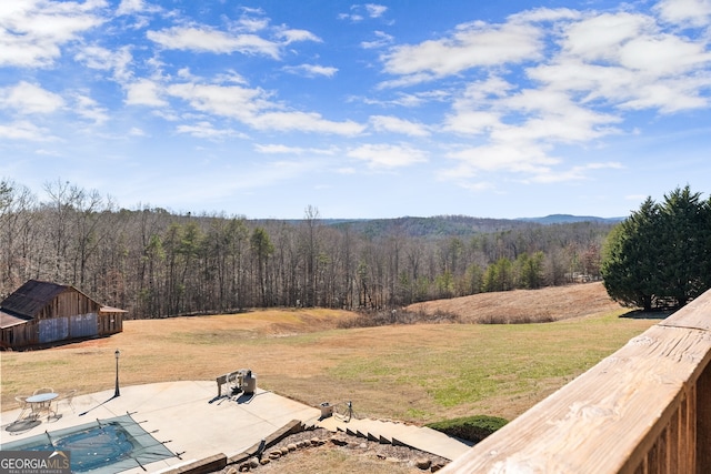 exterior space featuring a patio area and a view of trees