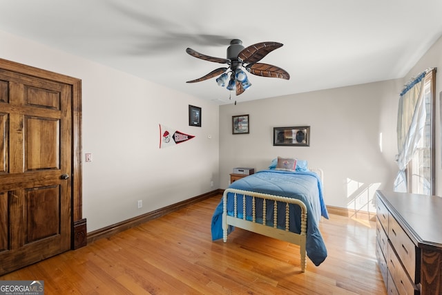 bedroom featuring light wood-type flooring, ceiling fan, and baseboards