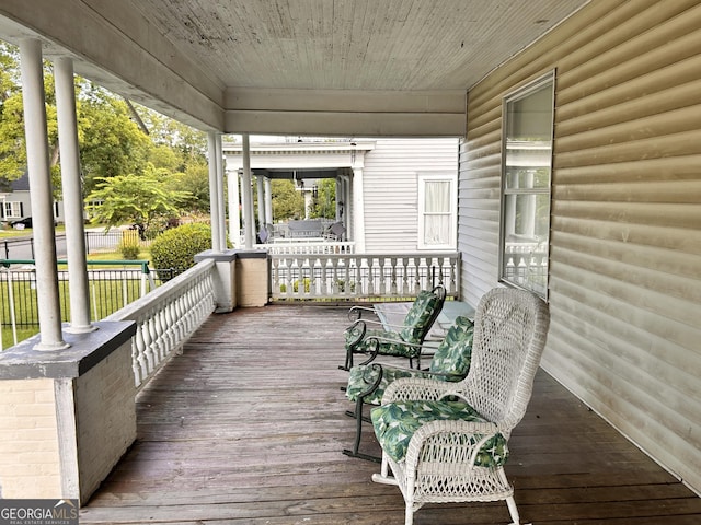 wooden terrace with covered porch