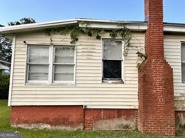 view of side of property featuring a chimney